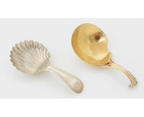 A George III silver caddy spoon, with a bright-cut bordered stem and a fluted shell bowl, initialled, by Hester Bateman, Lond