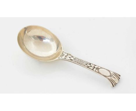 A Victorian silver caddy spoon, with a scroll terminal and engraved decoration on the back of the bowl and the front of the s