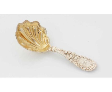 A Victorian silver caddy spoon, with a variety of leaves in relief around the stem and a gilt bowl, initialled, by Francis Hi