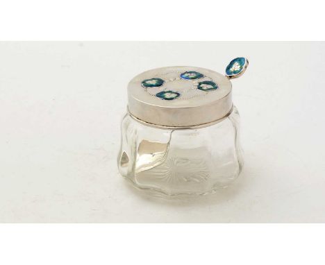 An Edwardian George V silver mounted art-nouveau preserve jar and cover; with matching spoon, decorated with enamelled cloud-
