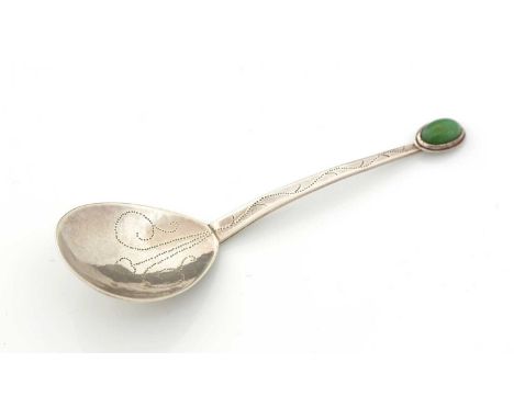 A rare Edwardian silver arts and crafts caddy spoon with a cabochon set greenstone terminal, a tapering stem and a drop-shape