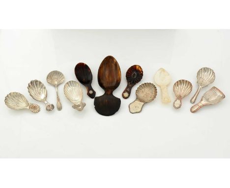 Two George III inlaid tortoiseshell caddy spoons; a carved mother of pearl caddy spoon; a larger horn spoon; and eight Old Sh