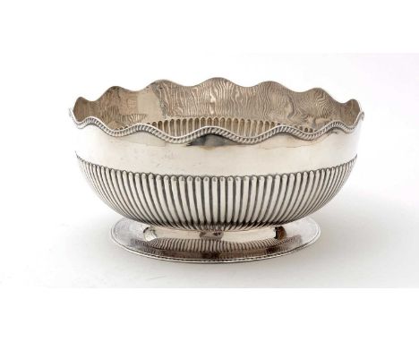 A late Victorian silver rose bowl, circular with part-fluting and a wavy, gadrooned rim, by R. Martin and E Hall, London C .1