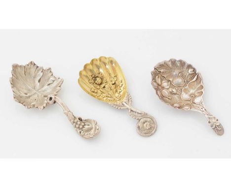 Two Victorian silver, Sheffield made caddy spoons, each stamped with florals and foliate decoration, by two different makers 