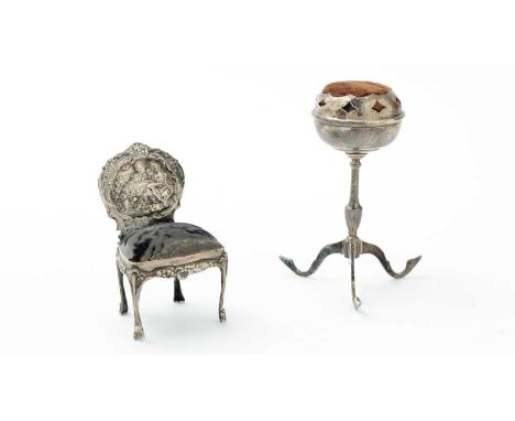 An Edwardian silver novelty pincushion, in the form of a miniature salon chair, by William Comyns, London 1902, and a silver 