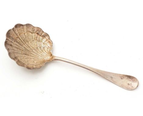 A late 19th Century French silver ladle, with a textured, scalloped shell bowl, engraved on the back of the terminal with the
