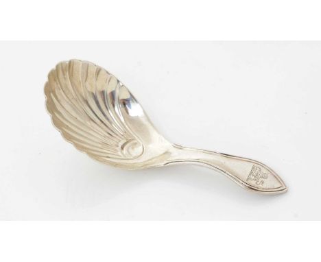 A George III silver caddy spoon, with a pointed thread bordered stem, fluted bowl, crested by Richard Crossley, London 1787, 