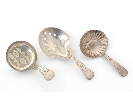 Three George III silver caddy spoons, all by Joseph Taylor, one with a pierced bowl, one with a fluted bowl and one engraved,