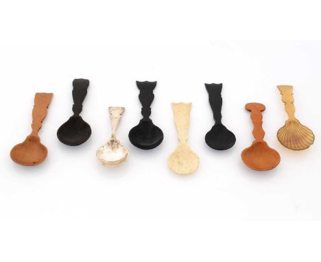 A collection of eight caddy spoons, in a variety of mediums (electroplate, horn, bone and various wood), with different shape