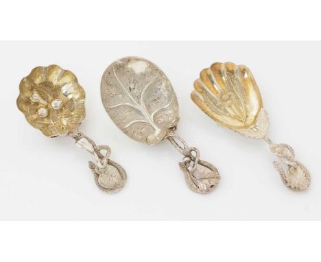 Three Victorian silver caddy spoons, with tendril stems (two with gilt bowls), all by Hilliard and Thomason of Birmingham, mi