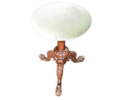 A good Victorian carved rotating, adjustable carved walnut music stool, with an upholstered seat, 49cm high (in lowest positi