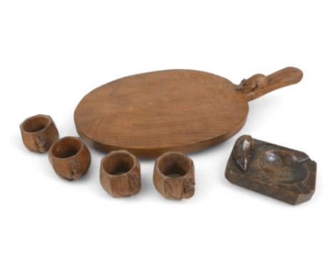 Robert 'Mouseman' Thompson of Kilburn (British, 1876-1955): a group of carved wooden items, comprising bread tray, 21.5 by 39
