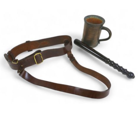 A rosewood Police truncheon with turned grip, stamped 84, plus a military brown leather Sam Brown belt with brass buckles and