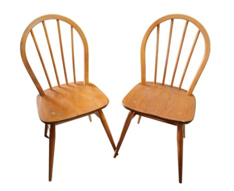 A pair of blonde Ercol elm seated kitchen chairs, 40 by 38 by 85cm high. 
