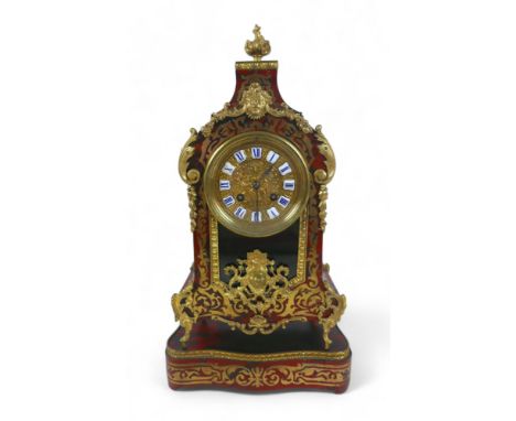A 19th century French bracket clock and stand, brass inlaid tortoiseshell and gilt metal mounted, the embossed brass dial wit