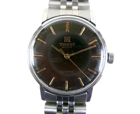A Tissot stainless steel gentleman's manual wind wristwatch, with black dial, baton markers, on a bracelet strap, 33mm case. 