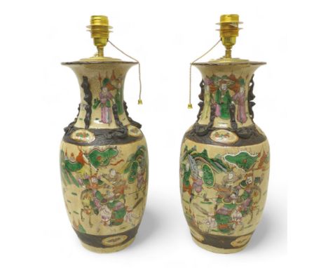 A pair of Chinese baluster vases / lamp bases, early to mid 20th century, decorated in green, pink and tan colors with raised