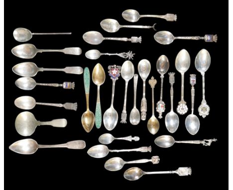 A small collection of silver teaspoons, comprising two Georg Jensen Danish silver teaspoons, one plain, one with scroll termi