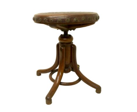 A Victorian bent wood adjustable piano stool with an embossed leather seat, 39 by 47cm high.