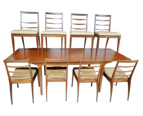 A mid 20th century A H McIntosh &amp; Co Ltd extending dining table, together with a set of eight similar style ladder back c