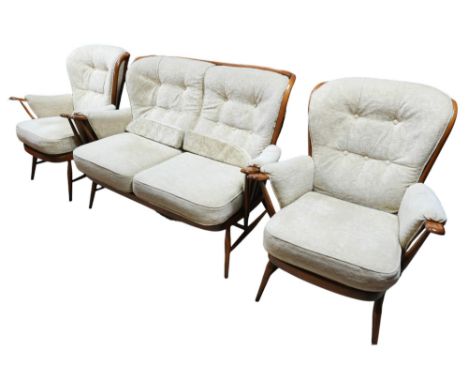 An Ercol autumn gold upholstered three piece suite. Settee measures 138 by 86 by 92cm. 