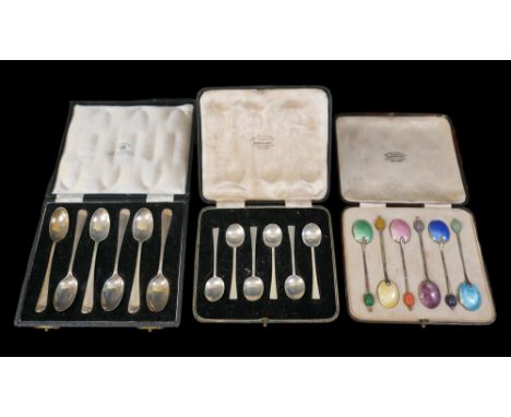 Three boxed sets of early to mid 20th century silver spoons, including a boxed set of silver enamel coffee spoons, total comb