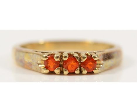 A 9ct gold fire opal three stone ring, Birmingham 2006, N, 2.6g