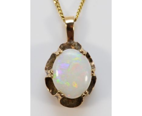 A 9ct gold vintage cabochon cut opal pendant with chain, 10mm opal length, 2.7gNeeds a clean, chain 44cm, opal in good condit