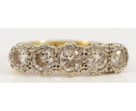An 18ct gold and brilliant cut diamond five stone illusion set ring, J 1/2, 3.5gm