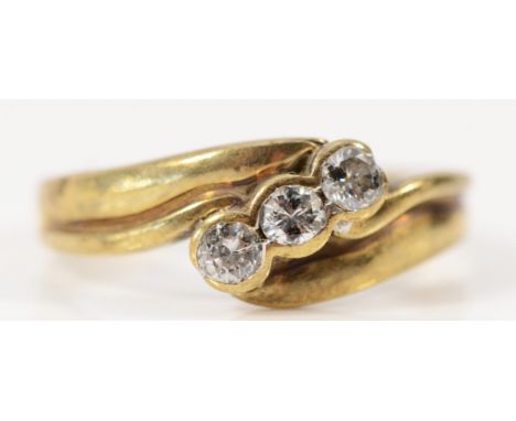 A 9ct gold vintage brilliant cut diamond three stone ring, spilt to the band, J 1/2, 1.9g