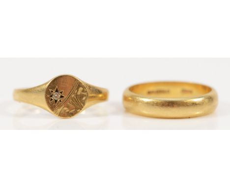 A 9ct gold wedding band, K 1/2 and a 9ct gold CZ signet ring, O, 4.8gm