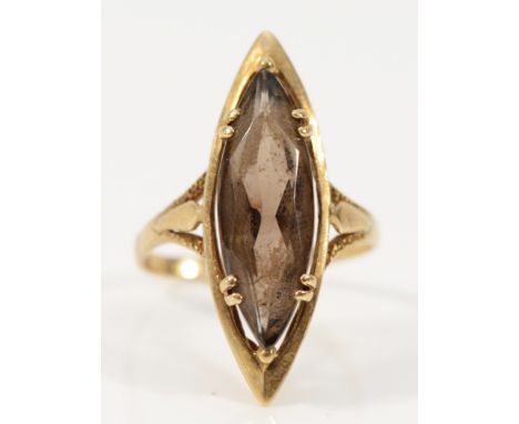 A 9ct gold marquise cut smokey quartz cocktail ring, 20mm x 7mm quartz, N, 3.7g