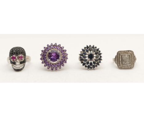 A silver and gemstone set skull ring, M and three other silver gemset rings, 27gm