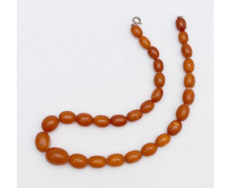 A butter scotch amber bead necklace, largest 17 x 13mm, 36cm, 22gm