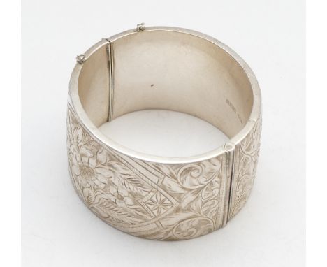A silver hinged bangle, Birmingham 1962, 60 x 58mm, width 38mm, 67gm