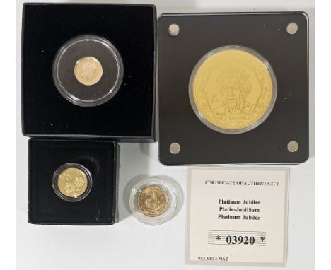 A 1985 1/10 Krugerrand, a 2017 proof Double Head quarter sovereign, a 2017 quarter sovereign, certificate and a Platinum Jubi