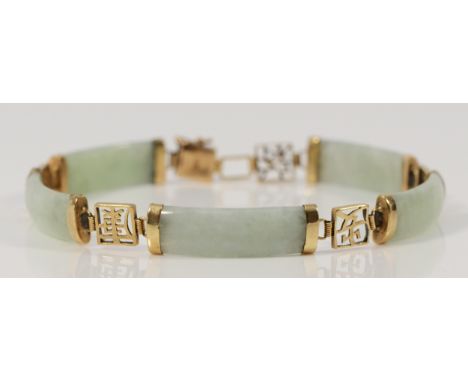 A 9ct gold jade bracelet with Chinese symbols, 11.2g