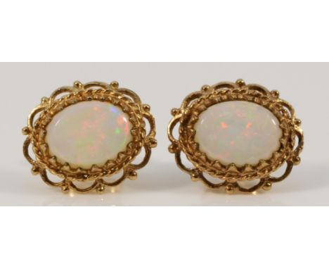 A pair of 9ct gold opal earrings with scroll backs, 12mm, 1.7gnot hallmarked, good condition, no issues