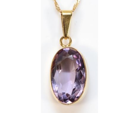 A 9ct gold vintage oval cut amethyst pendant with chain, 15mm x 10mm amethyst, 3.1g