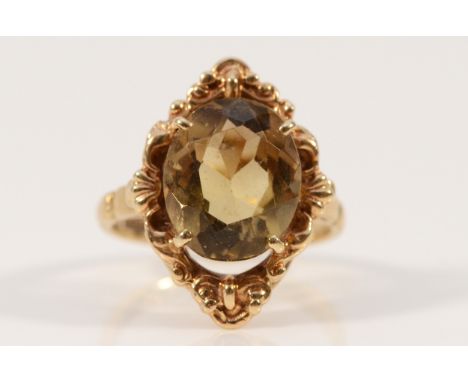 A 9ct gold citrine single stone dress ring, 12mm x 10mm citrine, K, 4.2g