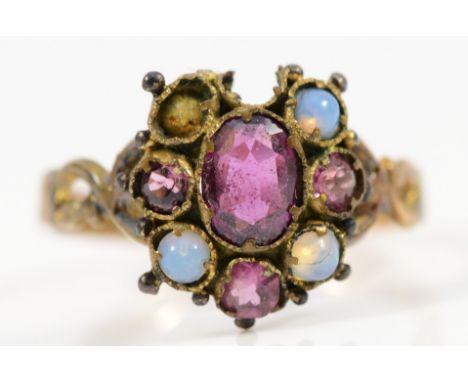 A 15ct gold antique opal and ruby dress ring, there are vacant settings and damage to one edge, M, 1.4g
