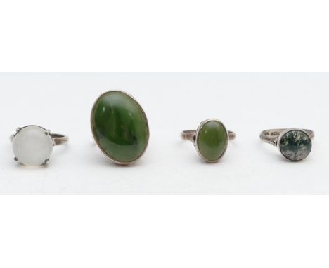 A silver and nephrite jade ring, N and three other rings, 21gm