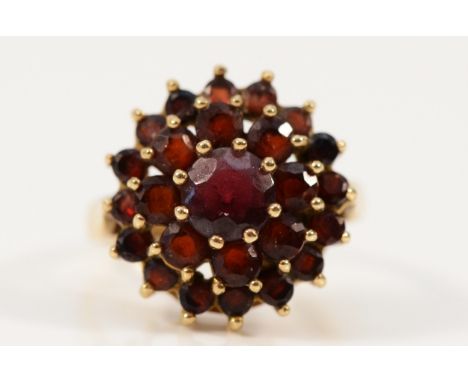 A 9ct gold vintage garnet cluster ring, 14mm ring front, F, 2.8g