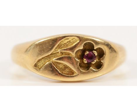 A 9ct gold signet ring with an engraved flower and a ruby, K 1/2, 1.9g