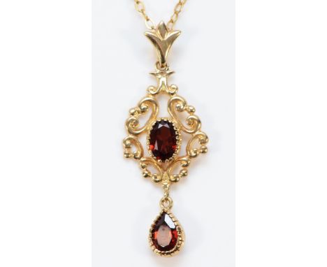 A 9ct gold vintage style garnet pendant with a 9ct gold chain, 38mm total length, 3.1g