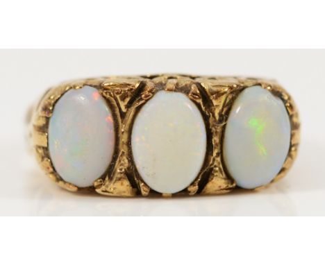 A 9ct gold vintage opal three stone ring with heart shaped gallery and shoulders, L, 2.9g