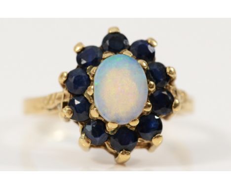 A 9ct gold opal and sapphire cluster ring, M, 2.9g
