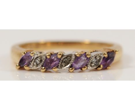 A 9ct gold diamond and amethyst seven stone ring, L 1/2, 2.2g