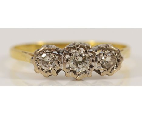 An 18ct gold and three brilliant cut diamond illusion set ring,  P, 2.5gm