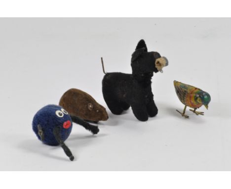 Group of novelty vintage toys including clockwork dog etc. (4)